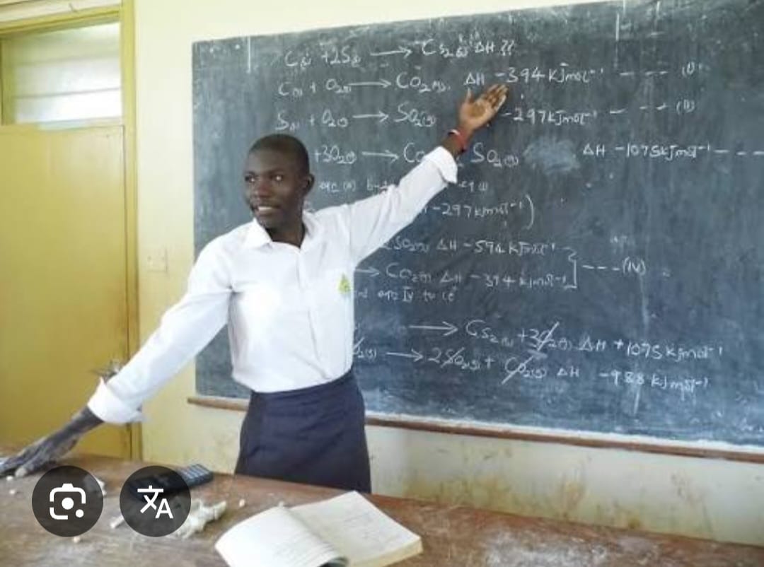 A student teaching at the chalkboard